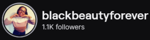 BlackBeautyForever's Twitch logo and follower count (1.1k). Logo is a picture of a smiling black woman with long braids. Image links to BlackBeautyForever's Twitch page.