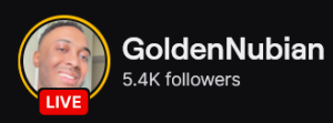 GoldenNubian's Twitch logo and follower count (5.4k). Logo is a smiling black man with amazing skin (He's my friend). Image links to GoldenNubian's Twitch page.
