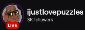 IJustLovePuzzles' Twitch logo and follower count (3k). Logo is a cartoon of a smiling black woman with grey hair and black framed glasses.
Image links to IJustLovePuzzles' Twitch page.
