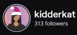KidderKat's Twitch logo and follower count (313). Logo is a cartoon style picture of a black woman with long straight hair and a Santa Clause' hat.
Image links to KidderKat's Twitch page.