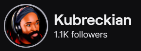 Kubreckian's Twitch logo and follower count (1.1k). Logo is a picture of a cartoon style black man with locs and full beard and mustache, wearing a red shirt and headphones. Image links to Kubreckian's Twitch page.
