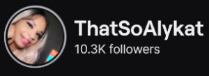 ThatSoAlyKat's Twitch logo and follower count (10.3k). Logo is a picture of a black woman with dark roots that ombre to a platinum blonde, with her hand resting under her chin. Image links to ThatSoAlyKat's Twitch page.