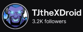 TJTheXDroid's Twitch logo and follower count (3.2k). Logo is a cartoon picture of a man with light purple skin with glowing blue eyes and a full beard. Image links to TJTheXDroid's Twitch page.