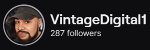 VintageDigital1's Twitch logo and follower count (287). Logo is a picture of a black man with full beard and wearing a grey baseball cap.
Image links to VintageDigital1'sTwitch page.