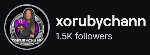 XORubyChann's Twitch logo and follower count (1.5k). Logo is a cartoon style picture of a black woman with long hair, holding a purple PS5 controller. Image links to XORubyChann's Twitch page.